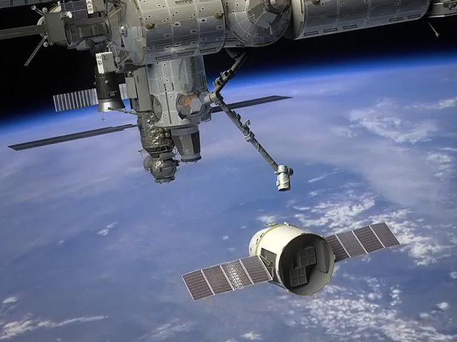 Ilustracin de la Dragon aproximndose a la ISS
